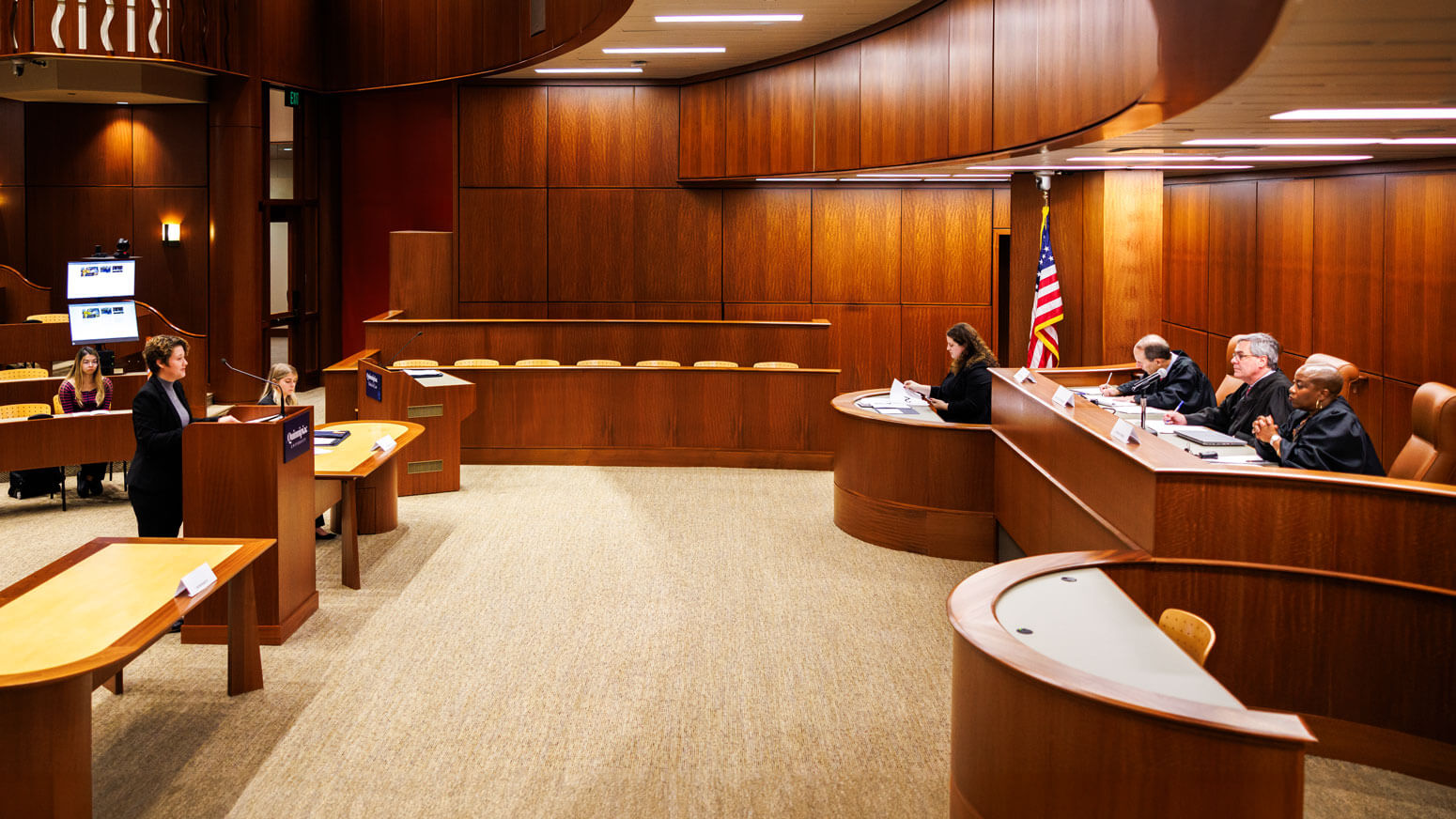 A Quinnipiac Law student participates in a mock trial in the North Haven Campus Ceremonial Courtroom.