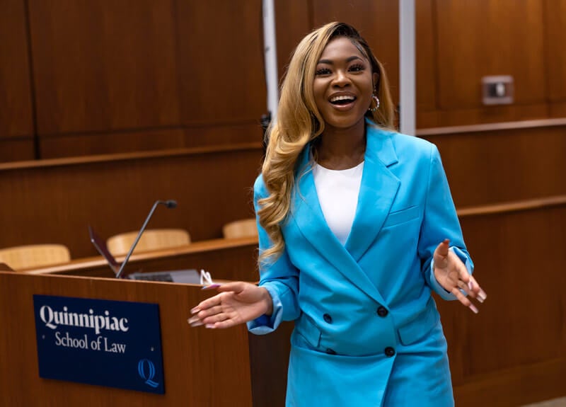 Quinnipiac student Fontaine Chambers speaks in the North Haven campus ceremonial courtroom