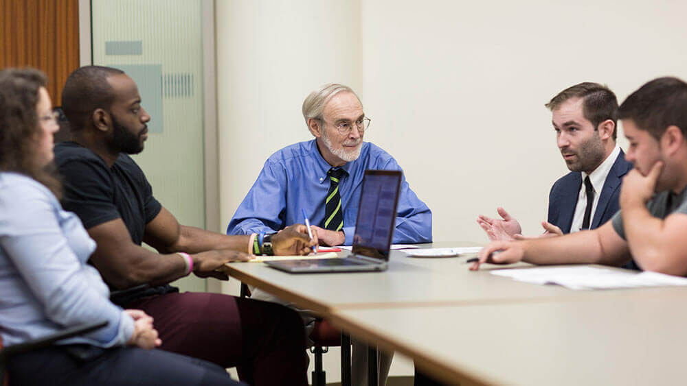 Co-director of the Center on Dispute Resolution Charlie Pillsbury leads a mediation session with students